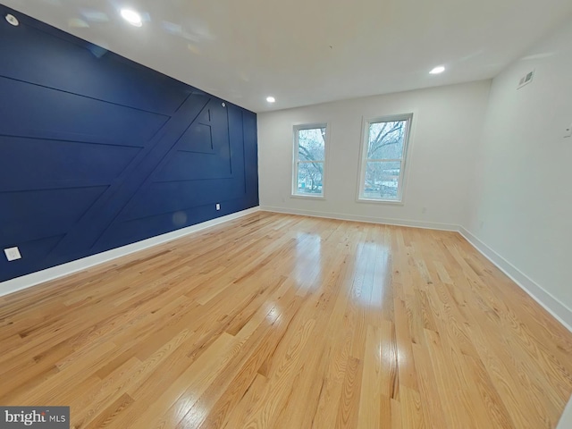 unfurnished room featuring light wood-type flooring