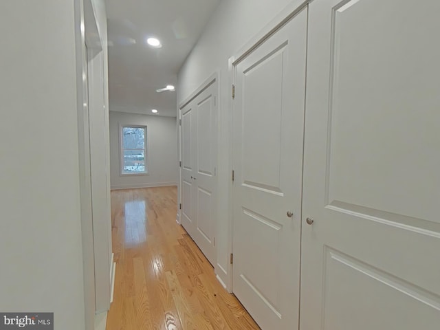 hall with light wood-type flooring