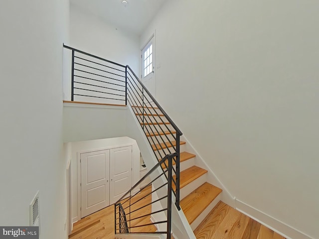 stairs with wood-type flooring