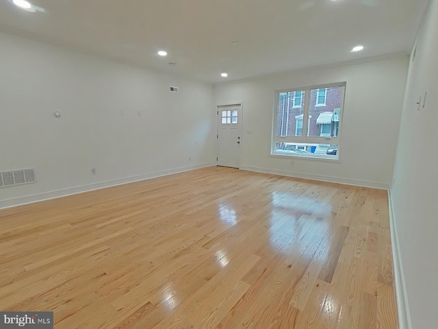 unfurnished room featuring light hardwood / wood-style floors