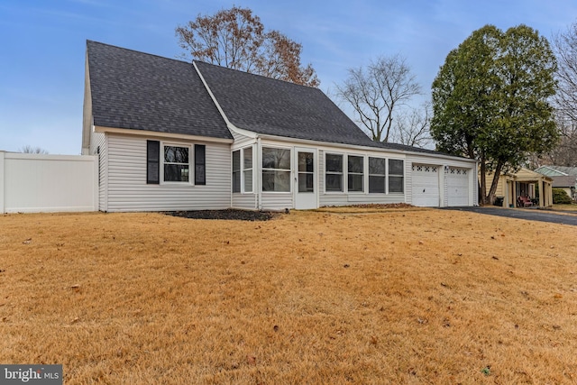 view of front facade with a front lawn and a garage