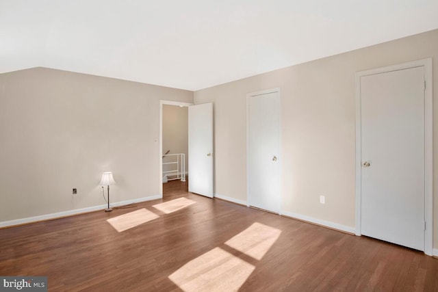 unfurnished bedroom featuring wood-type flooring