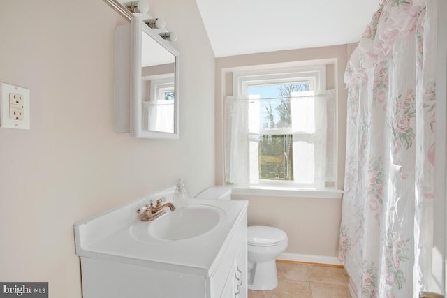 bathroom featuring tile patterned flooring, vanity, and toilet