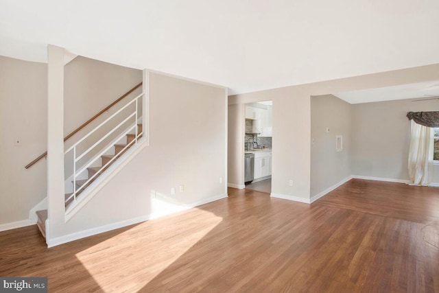 unfurnished living room with hardwood / wood-style floors