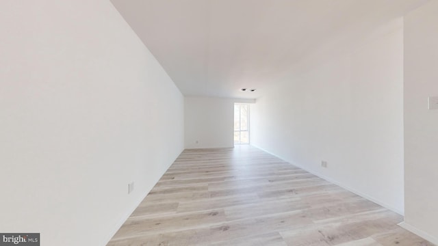 spare room featuring light hardwood / wood-style flooring