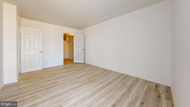 spare room featuring light wood-type flooring