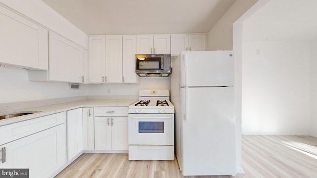 kitchen with white cabinetry, light wood-type flooring, white appliances, and sink