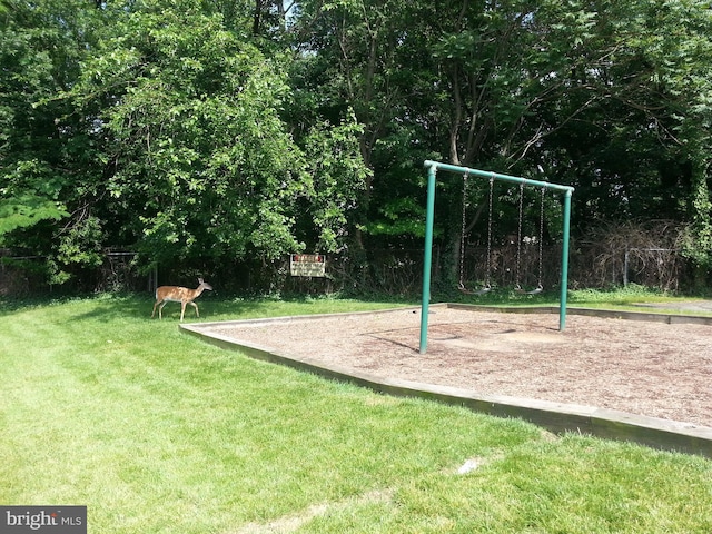 view of jungle gym featuring a yard