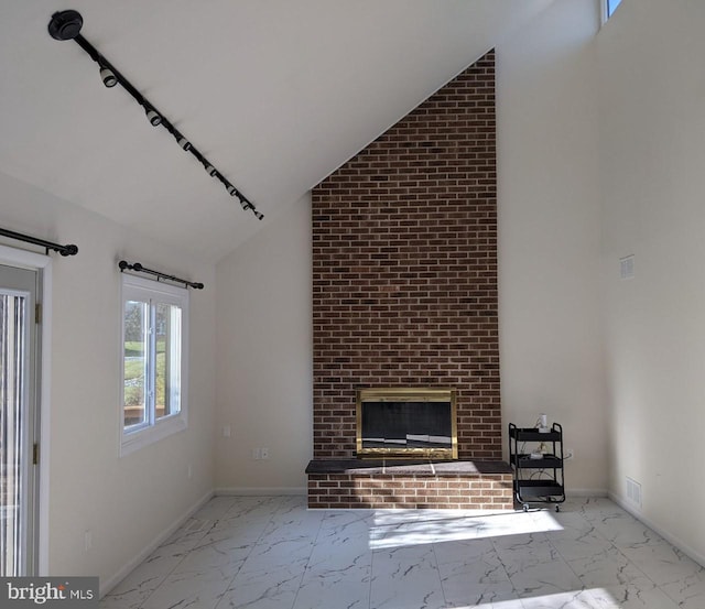 unfurnished living room featuring a fireplace and vaulted ceiling