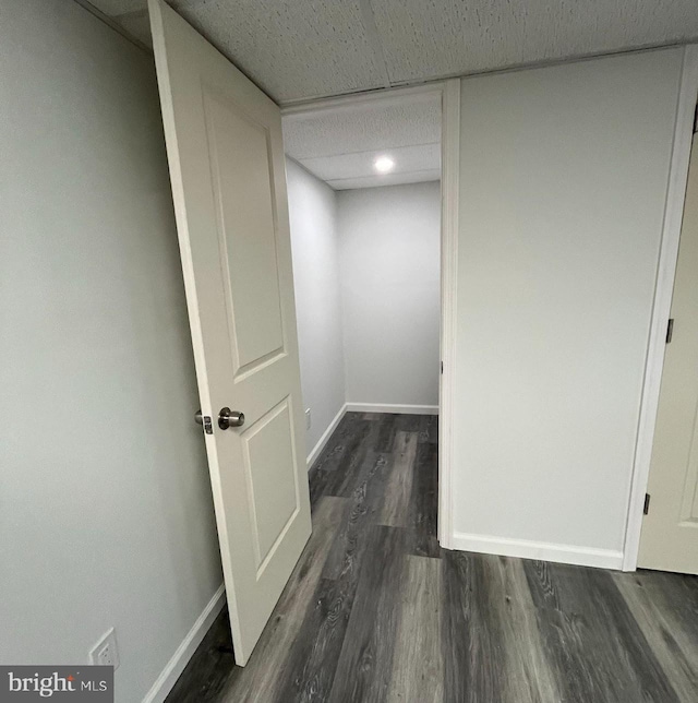 corridor featuring dark hardwood / wood-style floors