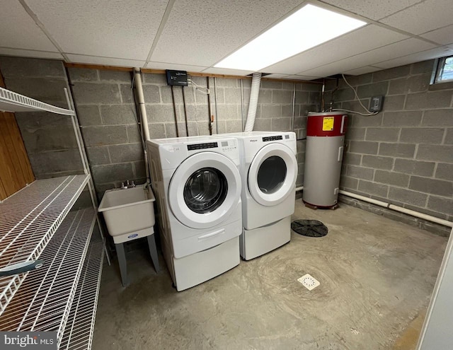 laundry room with washer and dryer, water heater, and sink