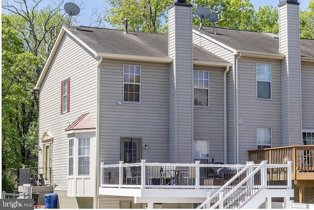 5310 Kelmscot Rd, Rosedale, MD 21237 - back of property featuring a wooden deck and a chimney