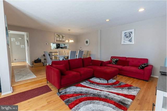 5310 Kelmscot Rd, Rosedale, MD 21237 - living area featuring visible vents, wood finished floors, baseboards, an inviting chandelier, and recessed lighting