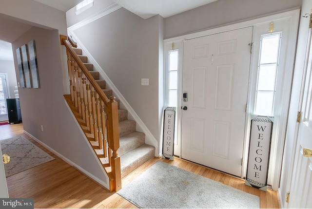 5310 Kelmscot Rd, Rosedale, MD 21237 - entryway with baseboards, stairway, and light wood-type flooring
