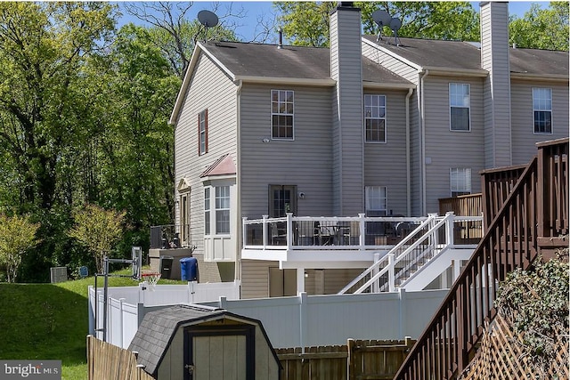 5310 Kelmscot Rd, Rosedale, MD 21237 - back of house with a fenced backyard, stairway, a shed, and a deck