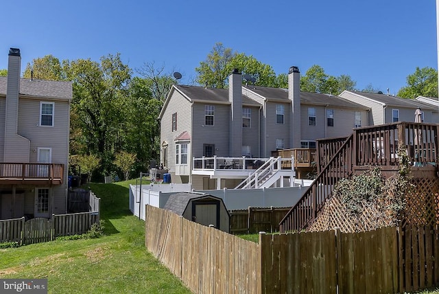 5310 Kelmscot Rd, Rosedale, MD 21237 - back of property featuring a fenced backyard, a wooden deck, a yard, and a residential view