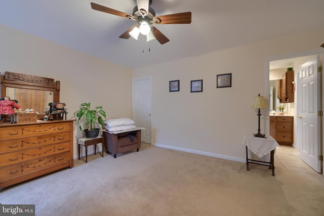 misc room featuring baseboards, a ceiling fan, and light colored carpet