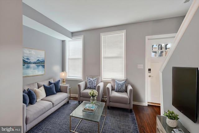 living room featuring dark wood-type flooring