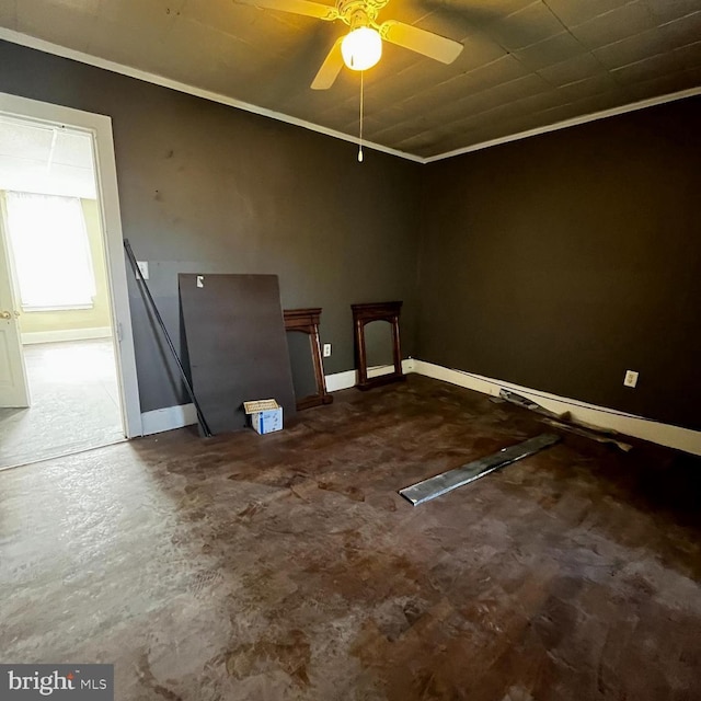 empty room featuring crown molding and ceiling fan