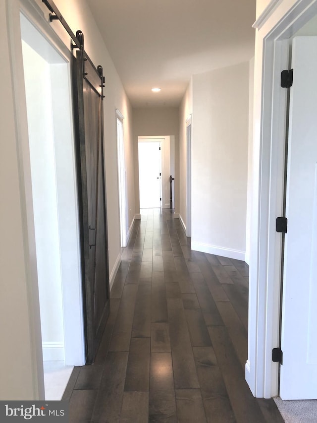 101 Burnt Mill Cir Unit 1B, Chadds Ford, PA 19317 - hallway with a barn door, recessed lighting, baseboards, and dark wood-style flooring