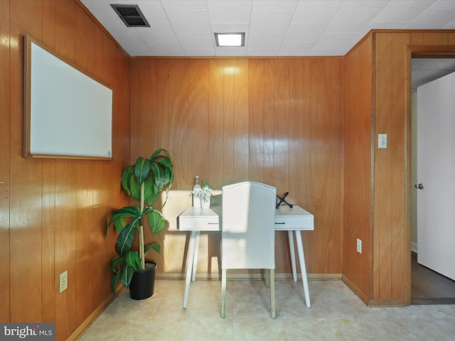 office area with wooden walls