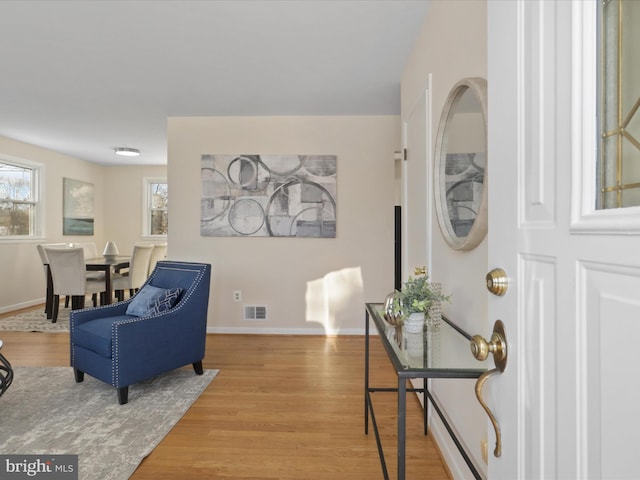 living area with hardwood / wood-style flooring