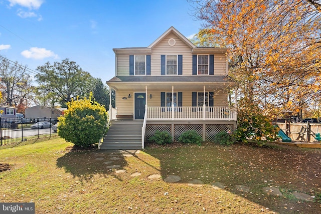 view of front of home with covered porch and a front yard