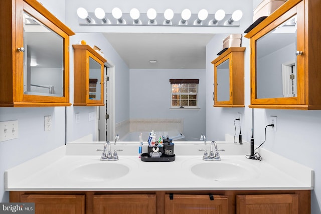 bathroom featuring vanity and a tub