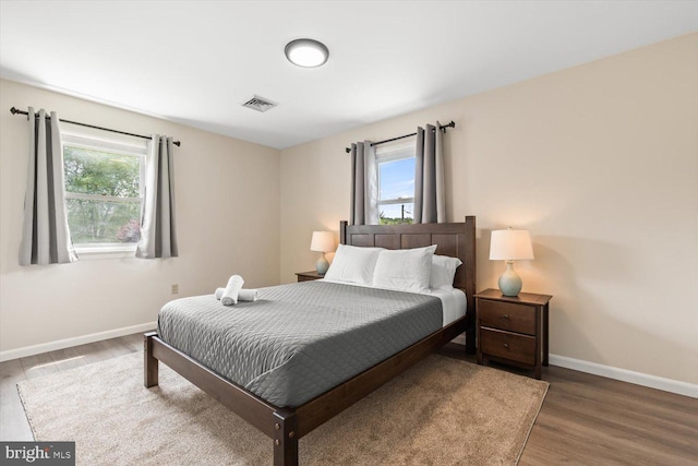 bedroom with hardwood / wood-style floors