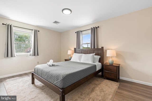 bedroom with hardwood / wood-style flooring