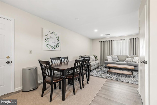 dining room with light hardwood / wood-style flooring