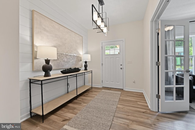 foyer entrance with french doors and light wood-type flooring