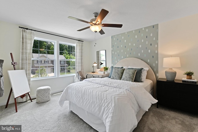 bedroom with ceiling fan and carpet floors