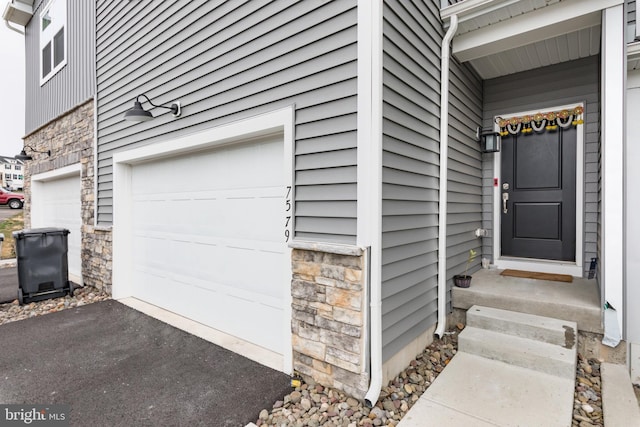 property entrance with a garage