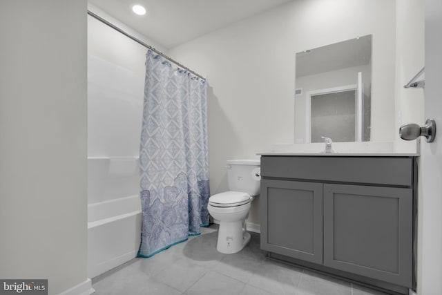 full bathroom with vanity, toilet, and shower / bath combo with shower curtain