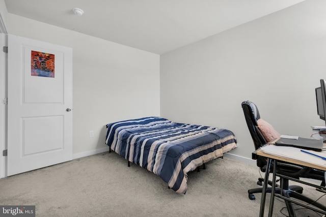 bedroom with light carpet