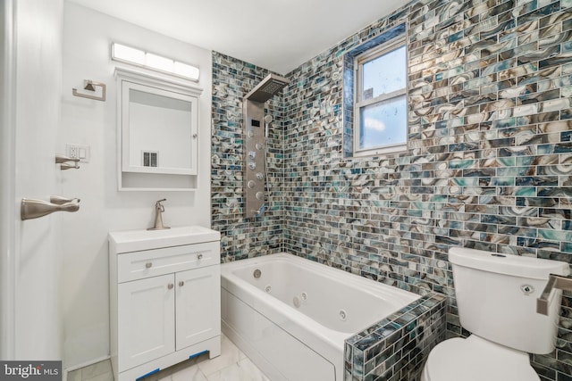 full bathroom featuring vanity, toilet, and tiled shower / bath combo