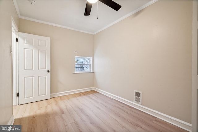 unfurnished room with ceiling fan, ornamental molding, and light wood-type flooring