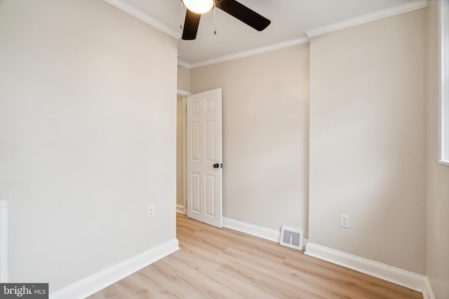 unfurnished room with ceiling fan, ornamental molding, and light wood-type flooring