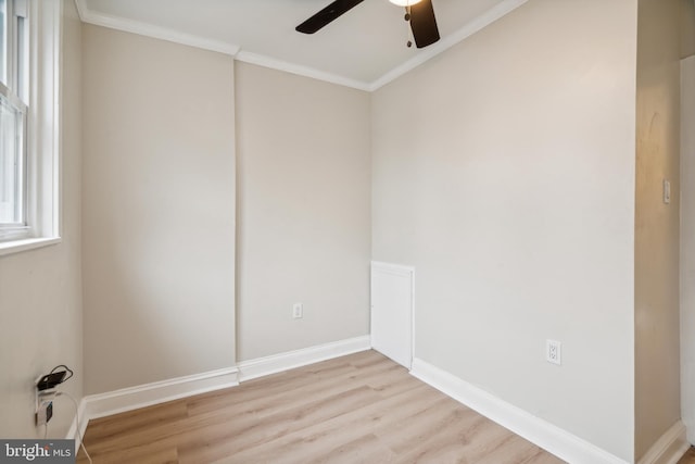 spare room with ceiling fan, light wood-type flooring, and ornamental molding