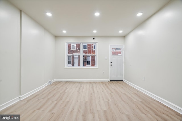 unfurnished room featuring light hardwood / wood-style flooring