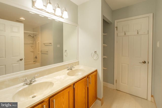 bathroom featuring vanity and shower / tub combination