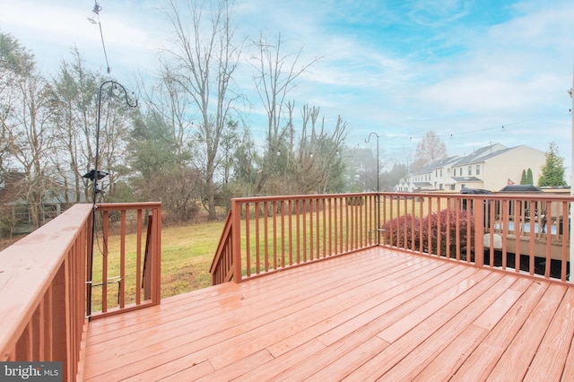 deck featuring a lawn