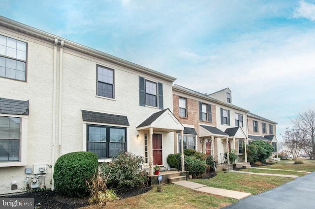 view of property with a front lawn