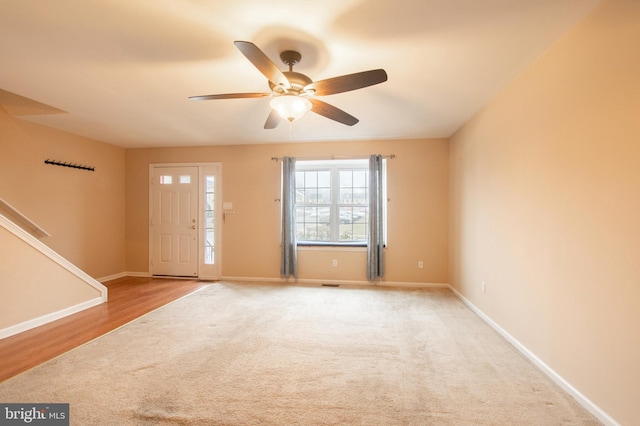 foyer entrance featuring hardwood / wood-style floors and ceiling fan