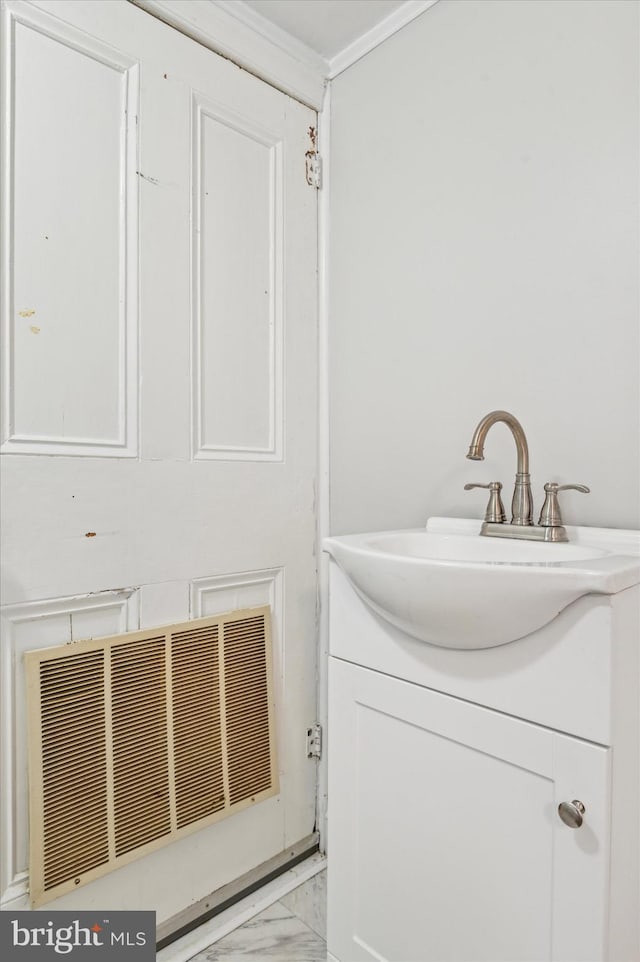 bathroom featuring vanity and crown molding