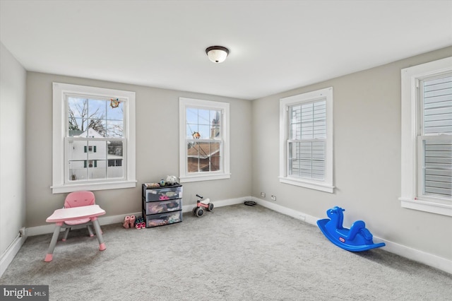 game room with carpet floors and plenty of natural light