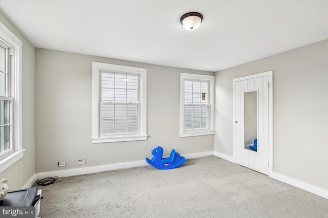 interior space featuring light colored carpet