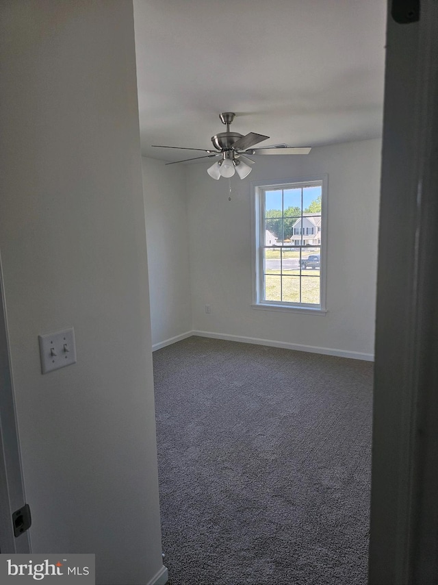 carpeted empty room with ceiling fan