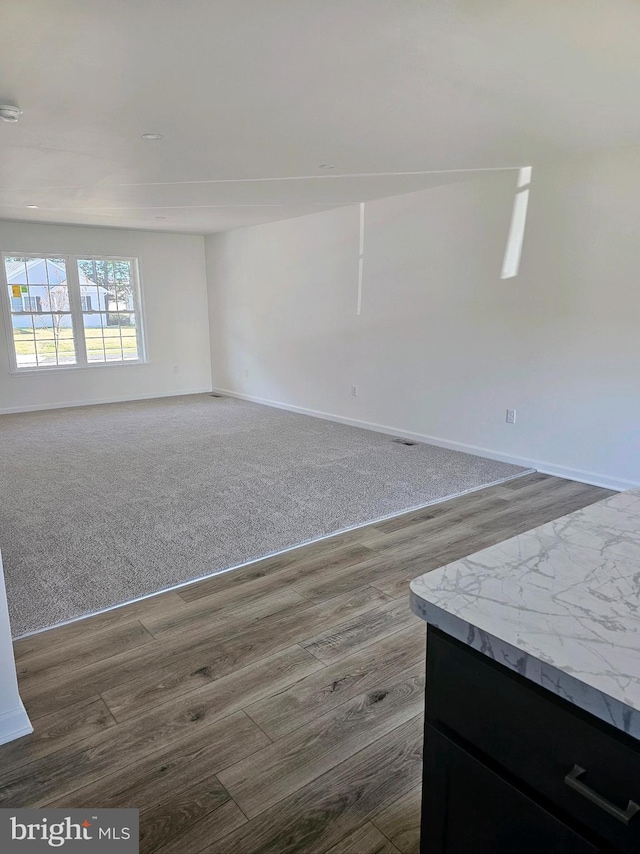 empty room featuring dark wood-type flooring